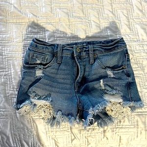 Lace detailed cut off jean shorts. 1 inch inseem